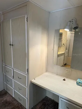 a bathroom with a sink and mirror