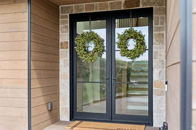 1400 Weber Wild Road Oakley, UT 84055 - Photo 7 of 55 Double-door entry featuring a black metal frame and clear glass panels