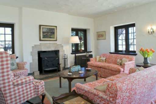 Undisclosed Address Darien, CT 06820 - Photo 3 of 8 a living room with furniture and a fireplace