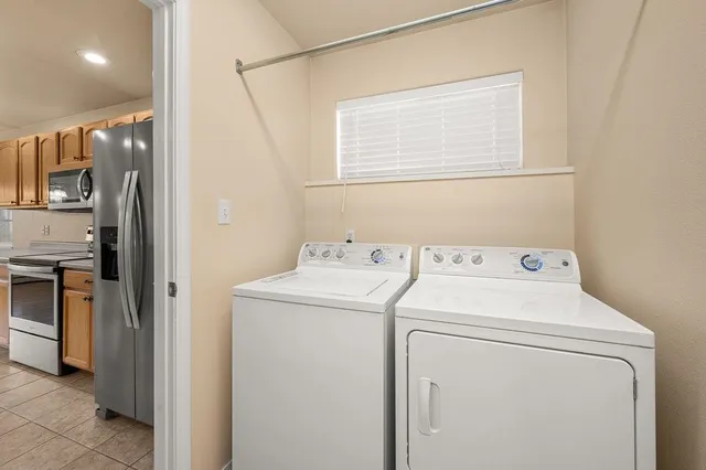 a view of storage and utility room with washer and dryer