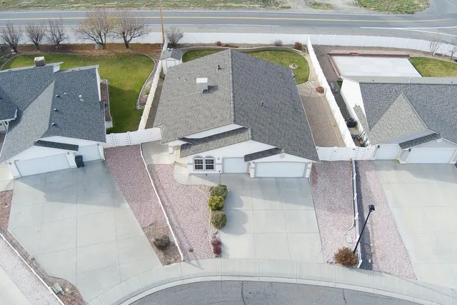 an aerial view of a house with pool patio and outdoor seating