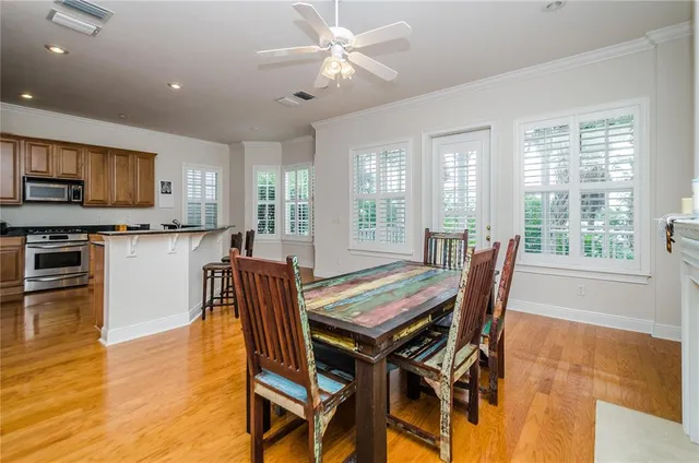a dining room with furniture and window