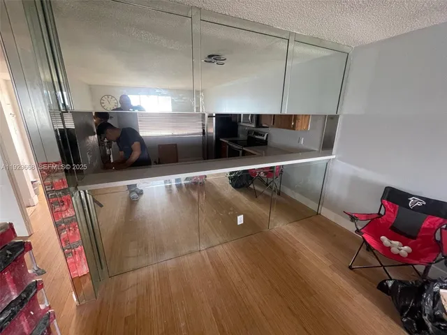 a view of a living room with furniture and a couch