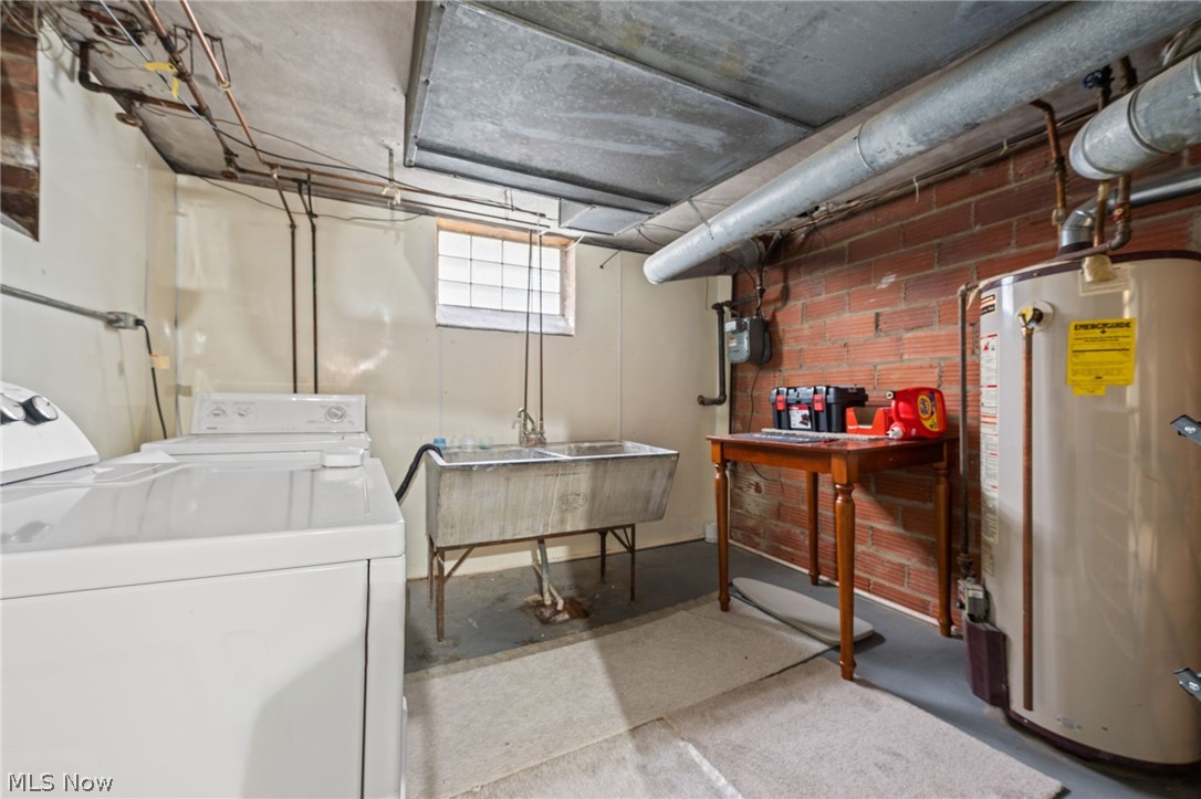 2368 Ashurst Road Cleveland, OH 44118 - Photo 17 of 20 Washroom with sink, washer and dryer, and gas water heater