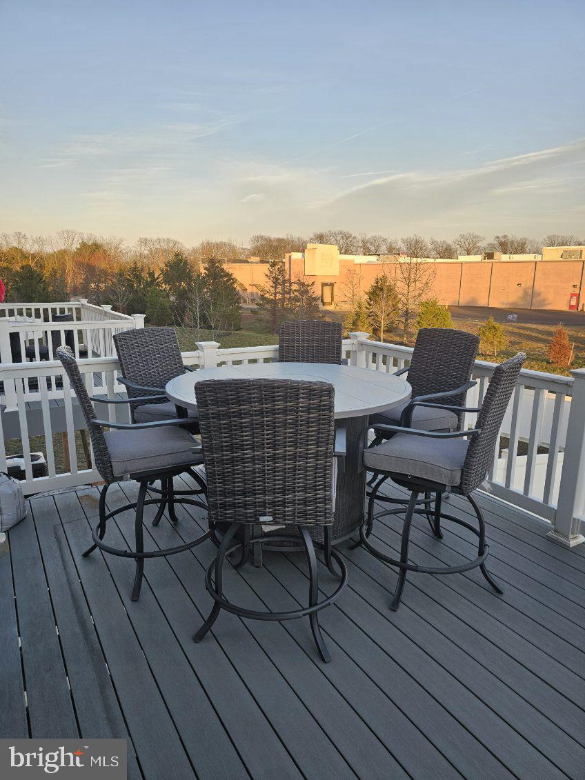 108 Freedom Way Sicklerville, NJ 08081 - Photo 4 of 9 a roof deck with outdoor seating and city view