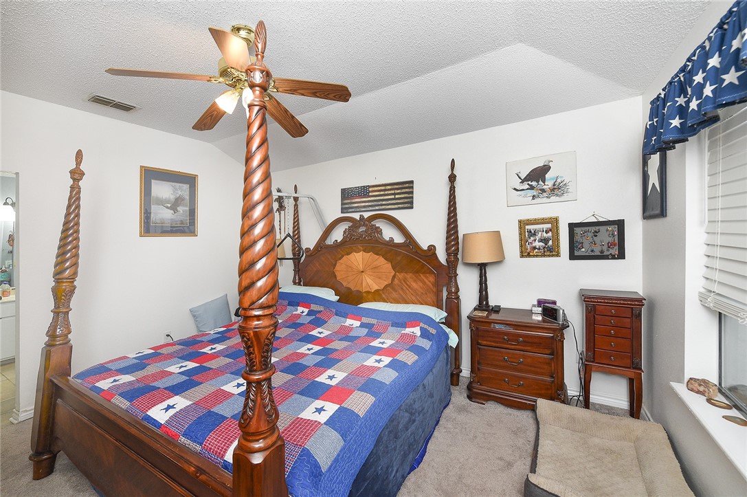 2101 Capeheart Street Ingleside, TX 78362 - Photo 15 of 39 a bedroom with a bed and dresser