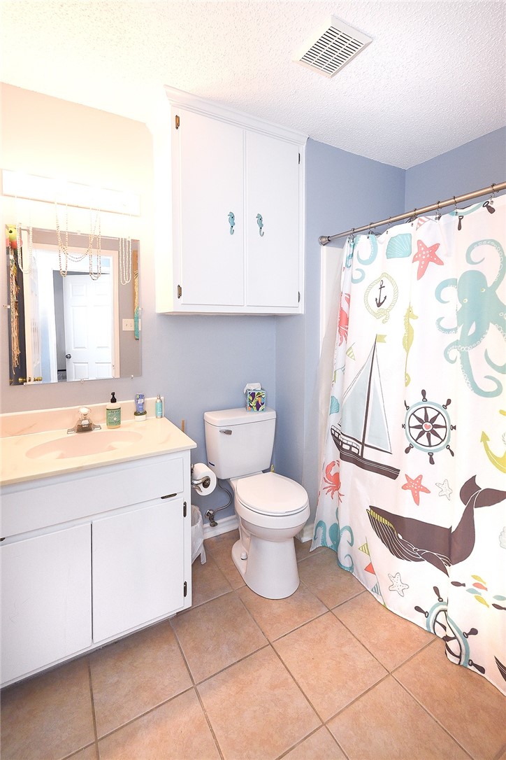 2101 Capeheart Street Ingleside, TX 78362 - Photo 21 of 39 a bathroom with a sink toilet and a mirror