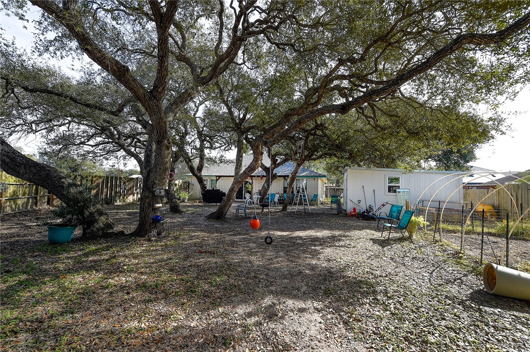 2101 Capeheart Street Ingleside, TX 78362 - Photo 29 of 39 a view of outdoor space with deck and trees