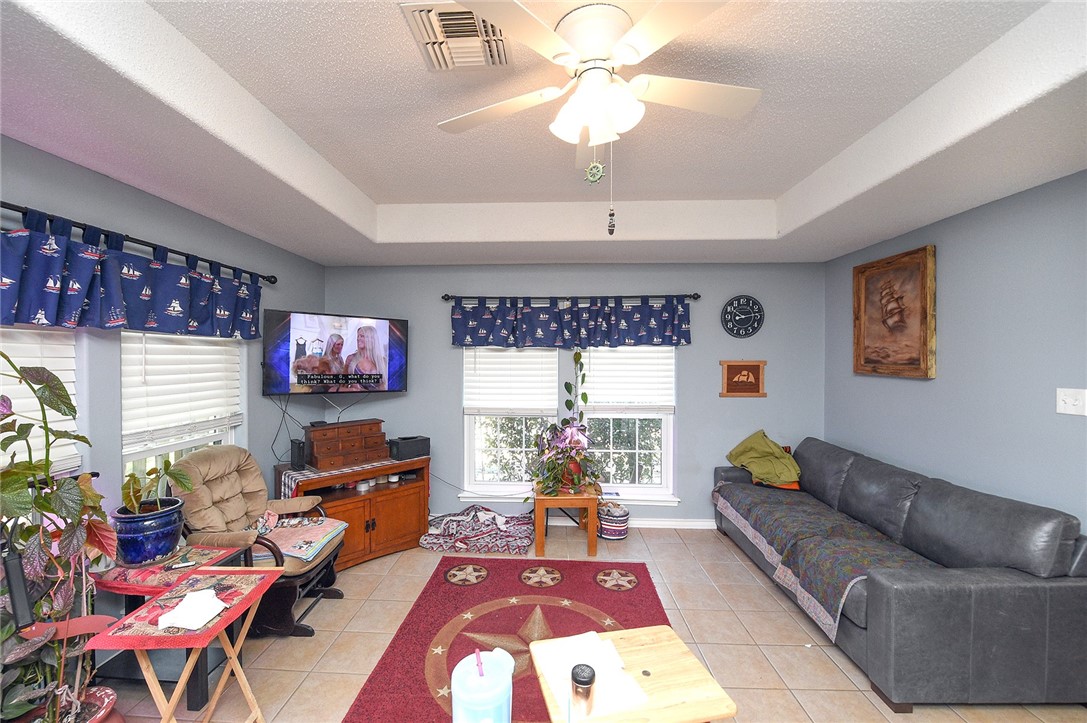 2101 Capeheart Street Ingleside, TX 78362 - Photo 6 of 39 a living room with furniture a chandelier and a window