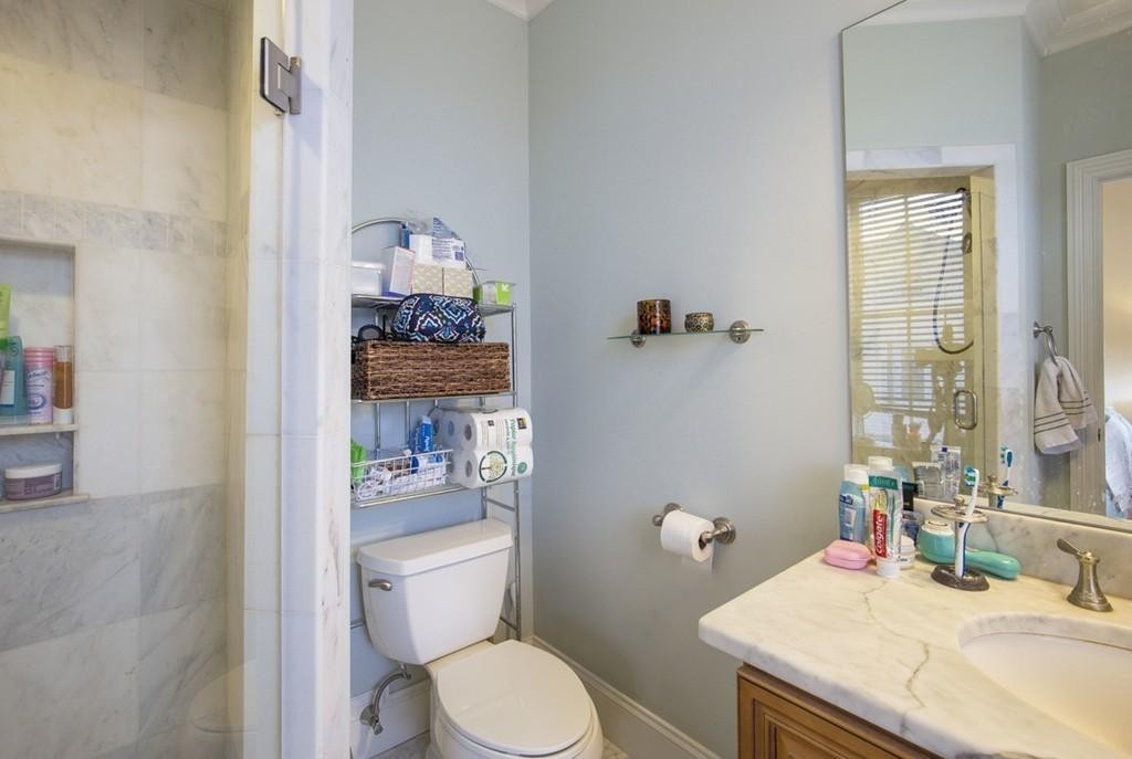 8 Gates Street, Unit 1 Boston, MA 02127 - Photo 12 of 14 a bathroom with a sink toilet and shower