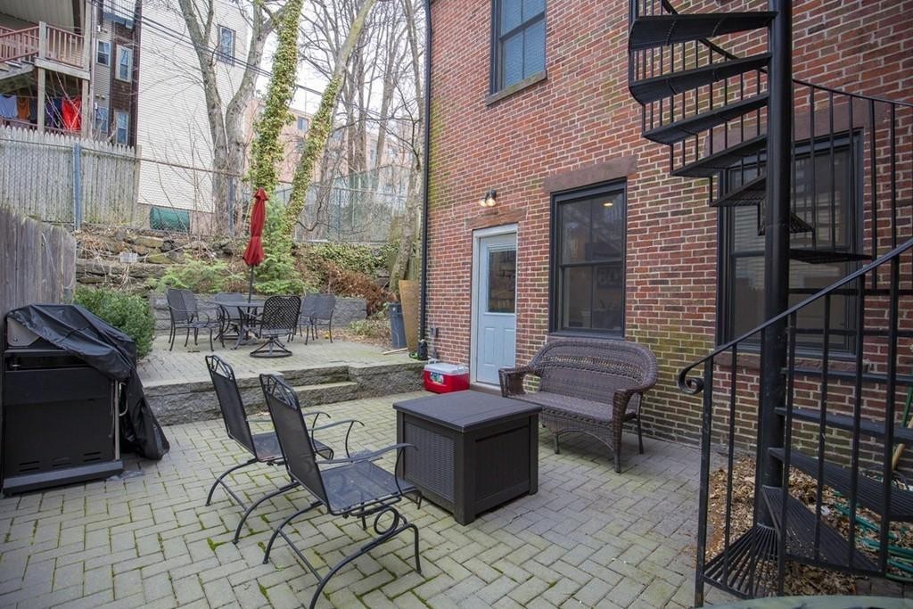 8 Gates Street, Unit 1 Boston, MA 02127 - Photo 7 of 14 a patio with table and chairs
