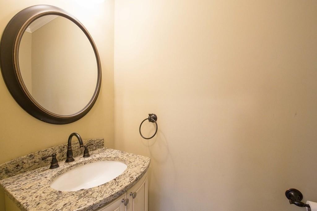 8 Gates Street, Unit 1 Boston, MA 02127 - Photo 9 of 14 a bathroom with a granite countertop sink and a mirror