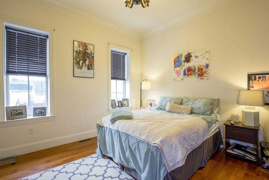 8 Gates Street, Unit 1 Boston, MA 02127 - Photo 10 of 14 a bedroom with a bed and a window
