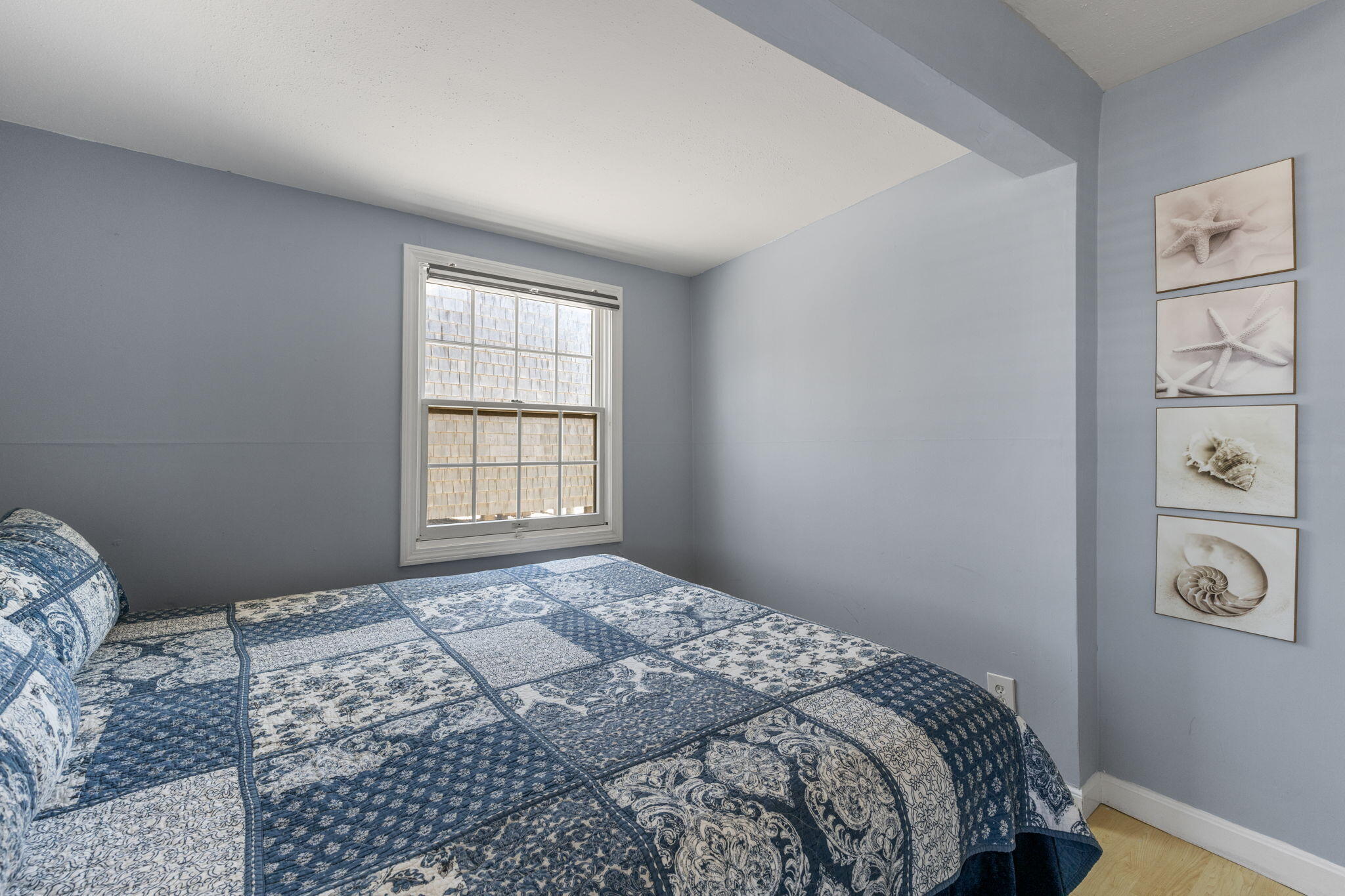 538 Shore Road, Unit 3 Truro, MA 02666 - Photo 13 of 27 a bedroom with a bed and a window