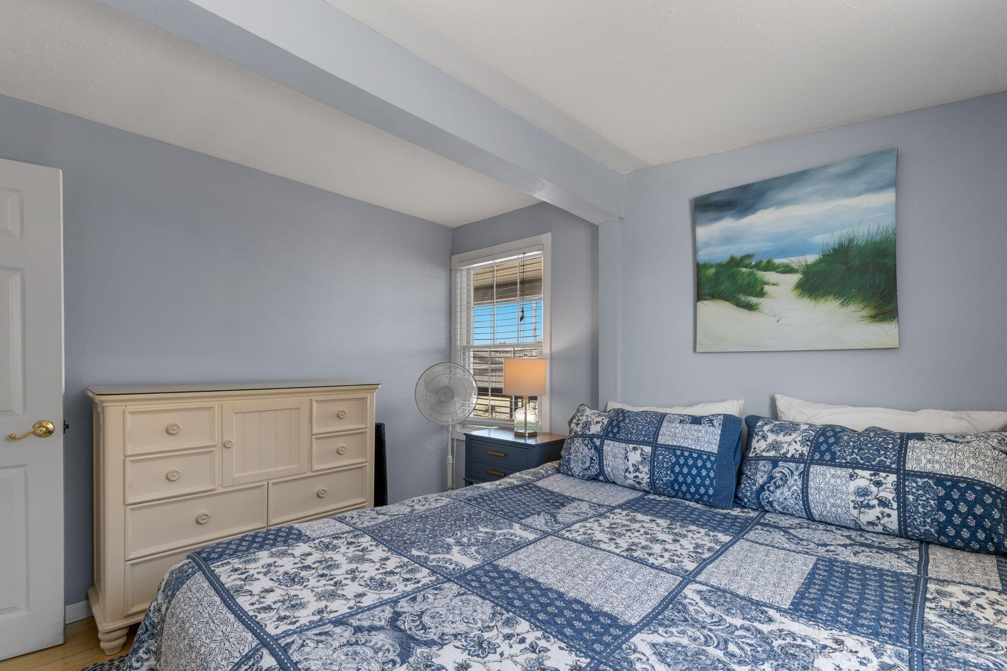 538 Shore Road, Unit 3 Truro, MA 02666 - Photo 26 of 27 a bedroom with a bed and dresser