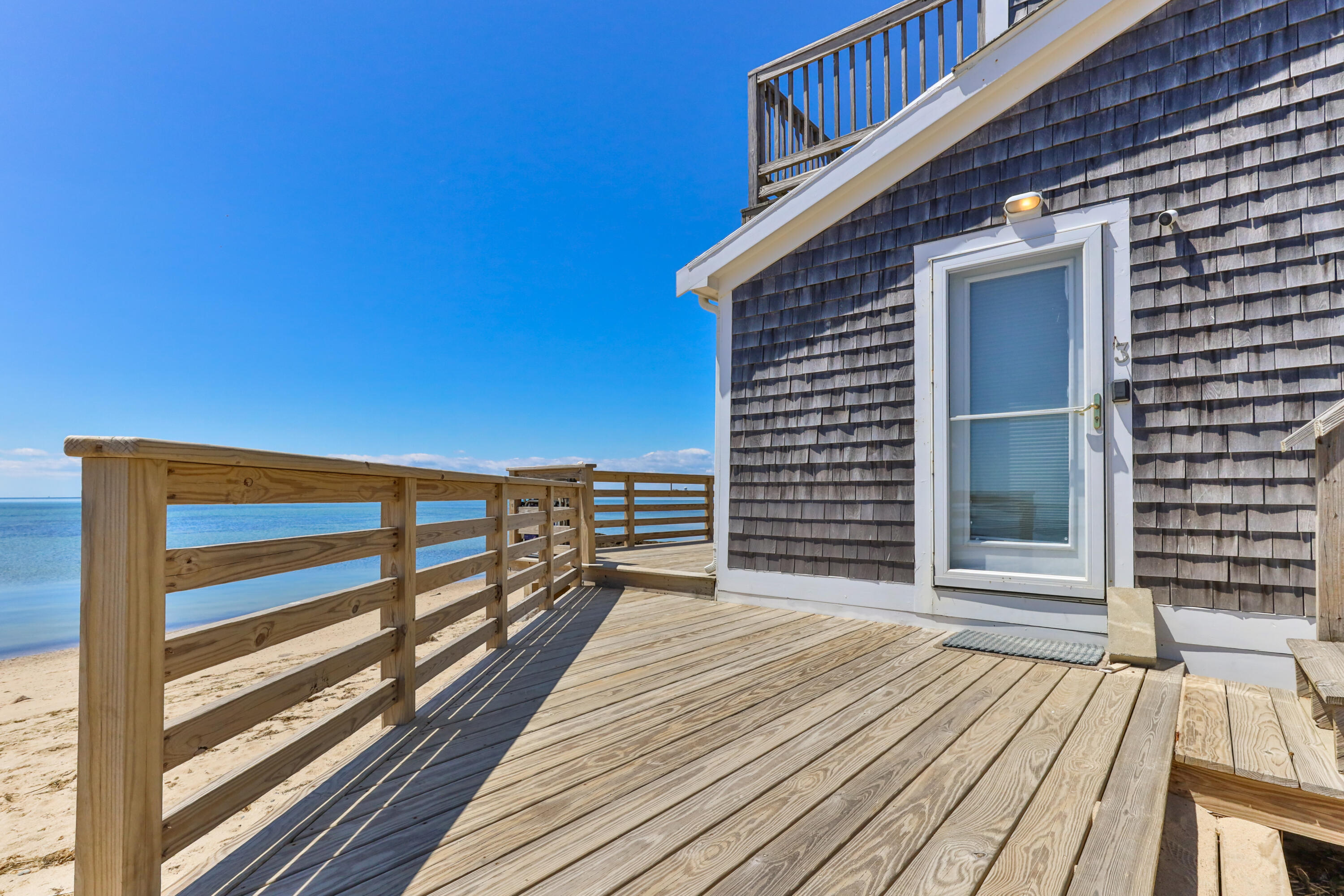 538 Shore Road, Unit 3 Truro, MA 02666 - Photo 3 of 27 a view of a balcony with wooden floor and city view