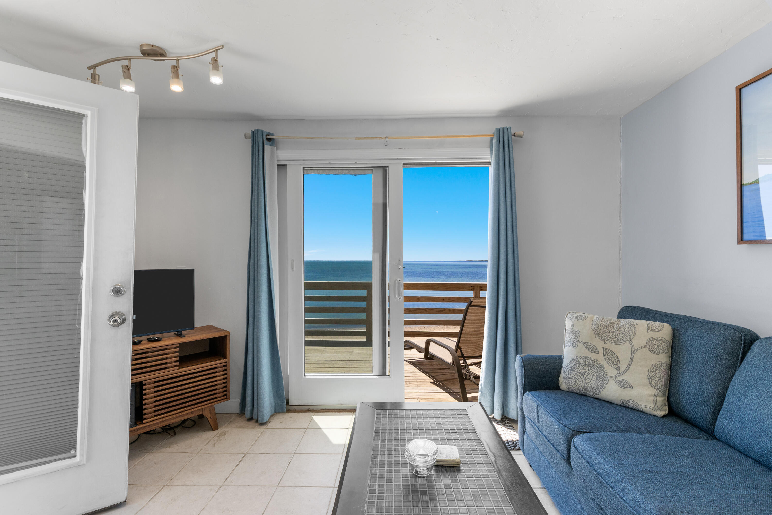 538 Shore Road, Unit 3 Truro, MA 02666 - Photo 6 of 27 a living room with furniture and a flat screen tv