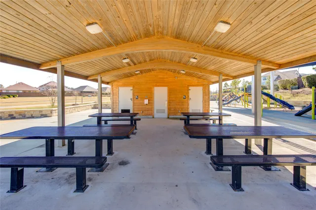 a view of a swimming pool with a table and chairs