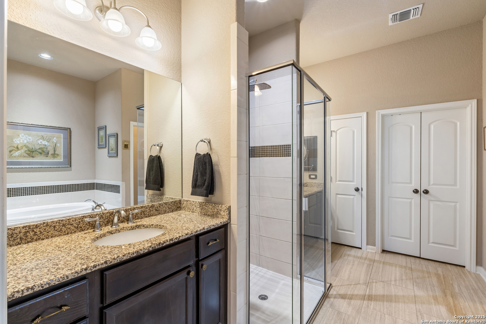 123 Gaucho Boerne, TX 78006 - Photo 13 of 26 a bathroom with a granite countertop sink shower and a mirror