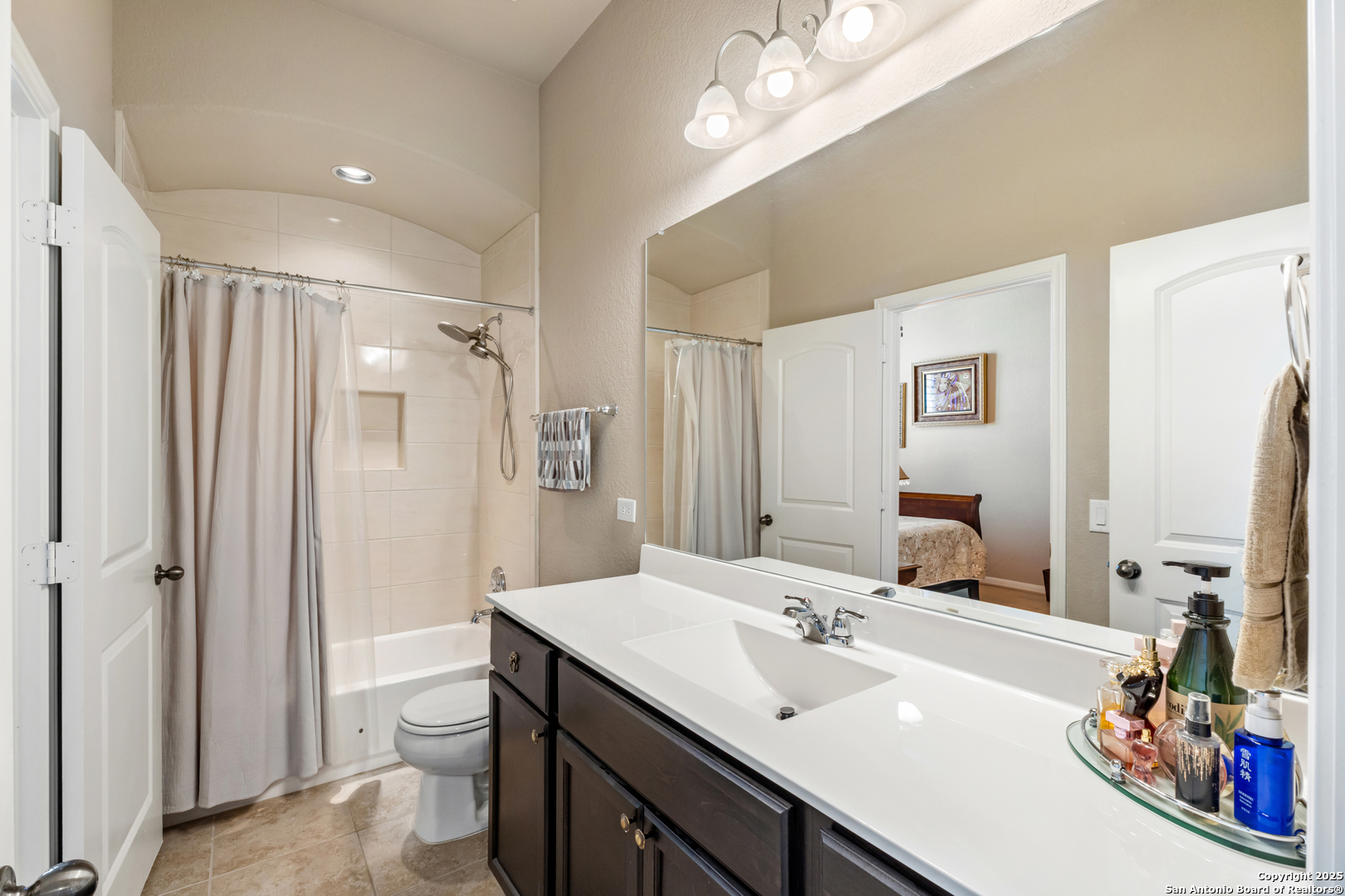 123 Gaucho Boerne, TX 78006 - Photo 16 of 26 a bathroom with a sink a toilet and a large mirror