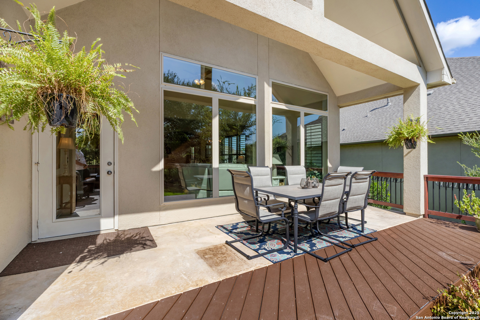 123 Gaucho Boerne, TX 78006 - Photo 19 of 26 a view of a patio with table and chairs and wooden floor