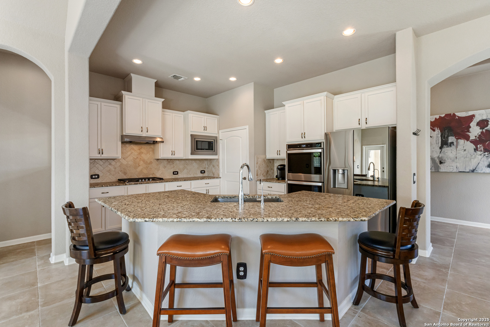 123 Gaucho Boerne, TX 78006 - Photo 6 of 26 a kitchen with stainless steel appliances granite countertop a table chairs sink and cabinets