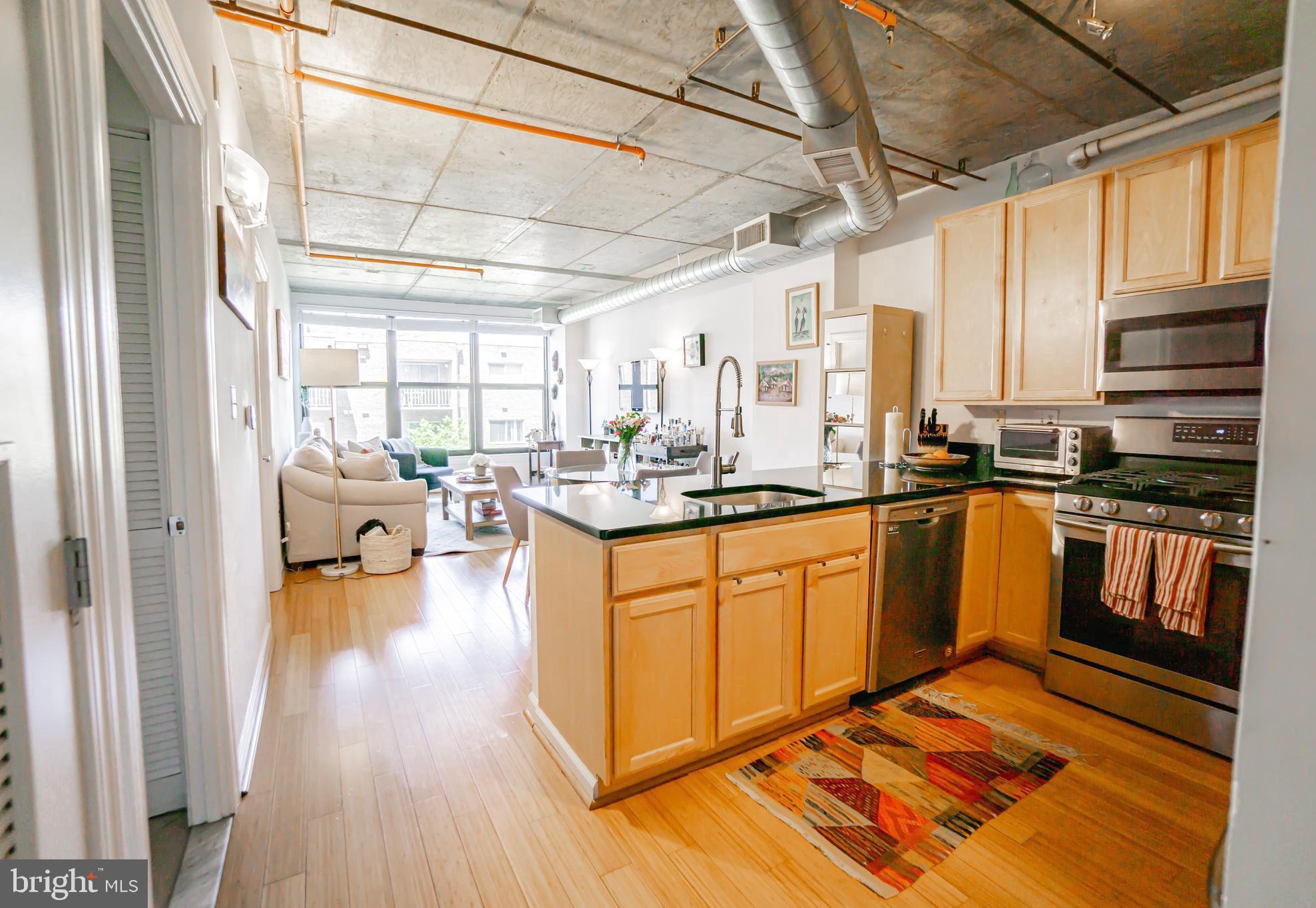 2750 14th Street Northwest, Unit 207 Washington, DC 20009 - Photo 5 of 17 Entrance view with open kitchen and living area