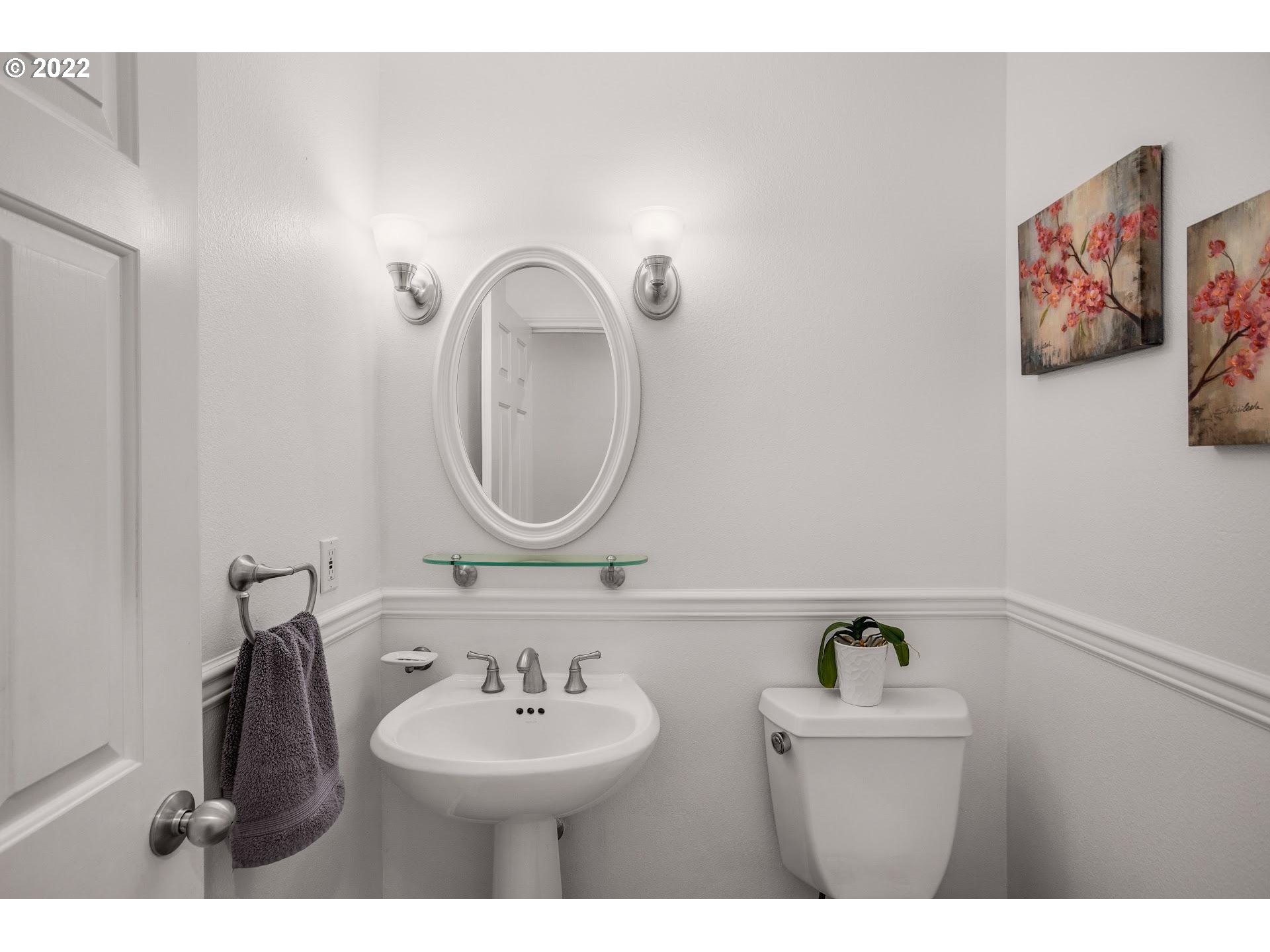 16625 Southwest Springwater Court Beaverton, OR 97006 - Photo 17 of 32 a bathroom with a sink and a mirror