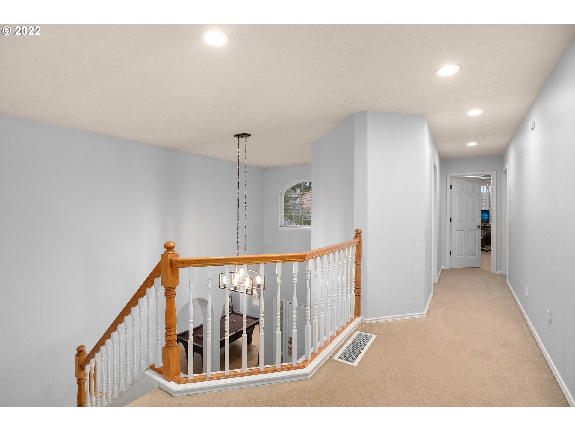 16625 Southwest Springwater Court Beaverton, OR 97006 - Photo 18 of 32 a view of a hallway with staircase