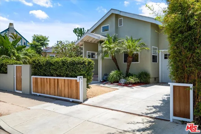 a front view of a house with yard