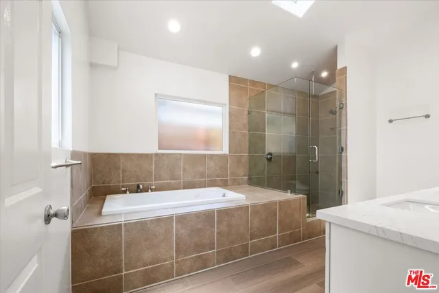 a bathroom with a bathtub and a shower