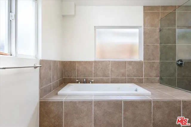 a bathroom with a bath tub