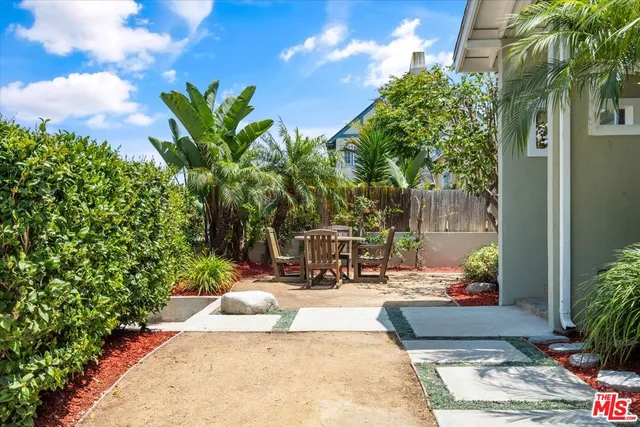 a view of a backyard with sitting area