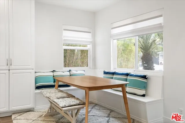 a room with a table and chairs