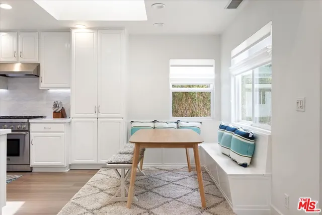 a kitchen with a sink and a stove top oven