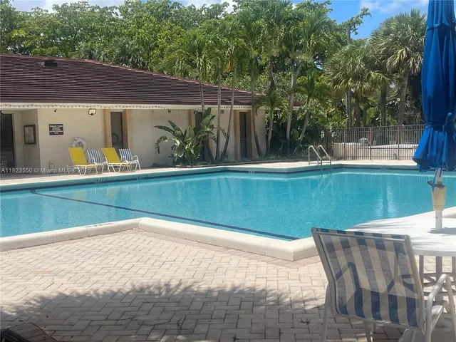 a building with potted plants in front of it