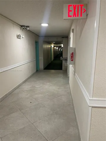 view of a room that has a mirror in it