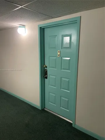a kitchen with a stove and a refrigerator