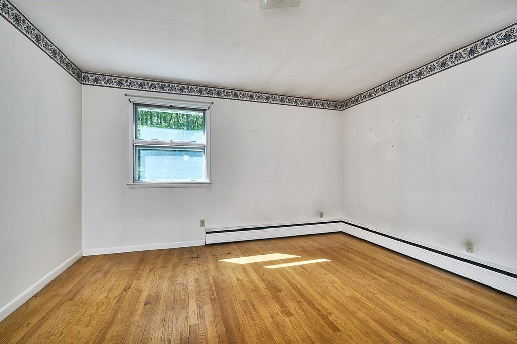 20 Southampton Road Holyoke, MA 01040 - Photo 11 of 28 a room with a wooden floor and a window