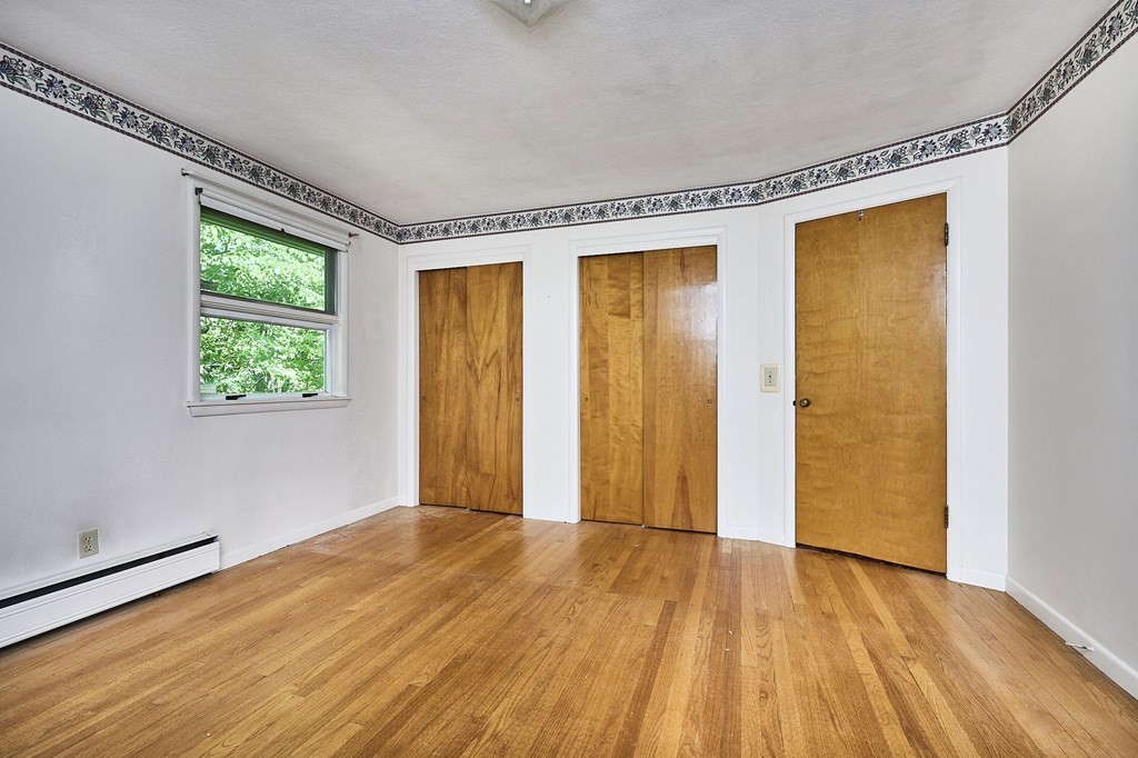20 Southampton Road Holyoke, MA 01040 - Photo 12 of 28 a view of an empty room with wooden floor and a window
