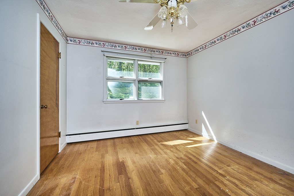 20 Southampton Road Holyoke, MA 01040 - Photo 13 of 28 a view of an empty room with wooden floor and a window