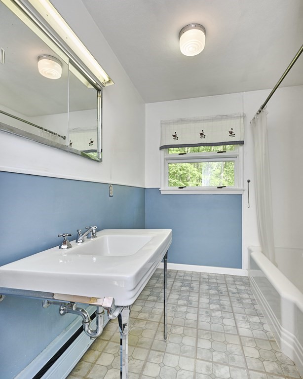 20 Southampton Road Holyoke, MA 01040 - Photo 14 of 28 a bathroom with a sink a vanity and a mirror