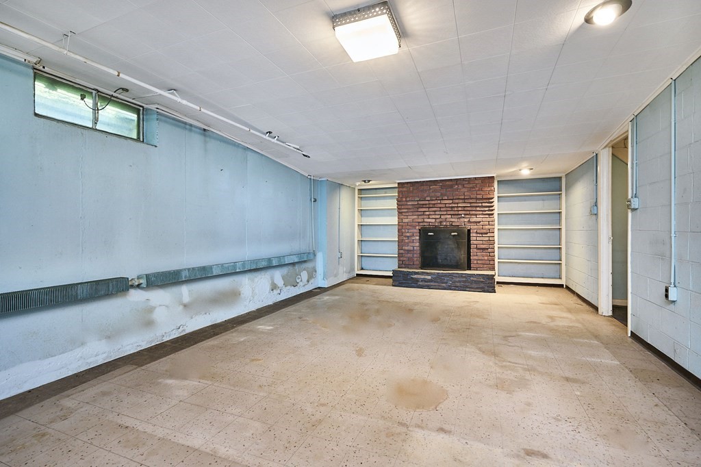 20 Southampton Road Holyoke, MA 01040 - Photo 16 of 28 a view of an empty room with a fireplace and a window