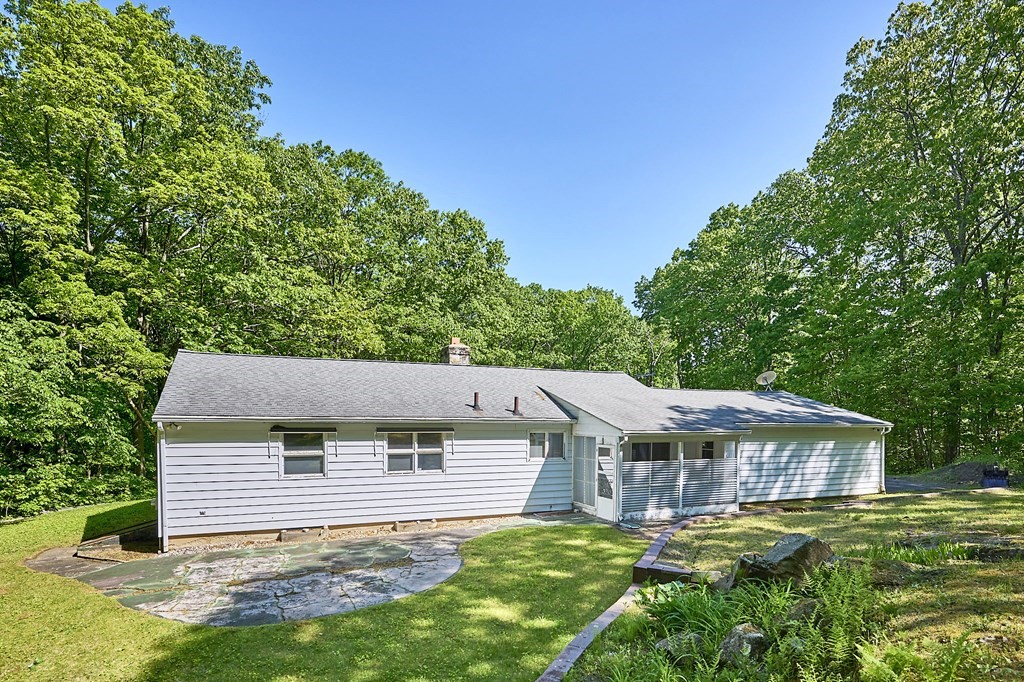 20 Southampton Road Holyoke, MA 01040 - Photo 20 of 28 a backyard of a house with plants and large trees