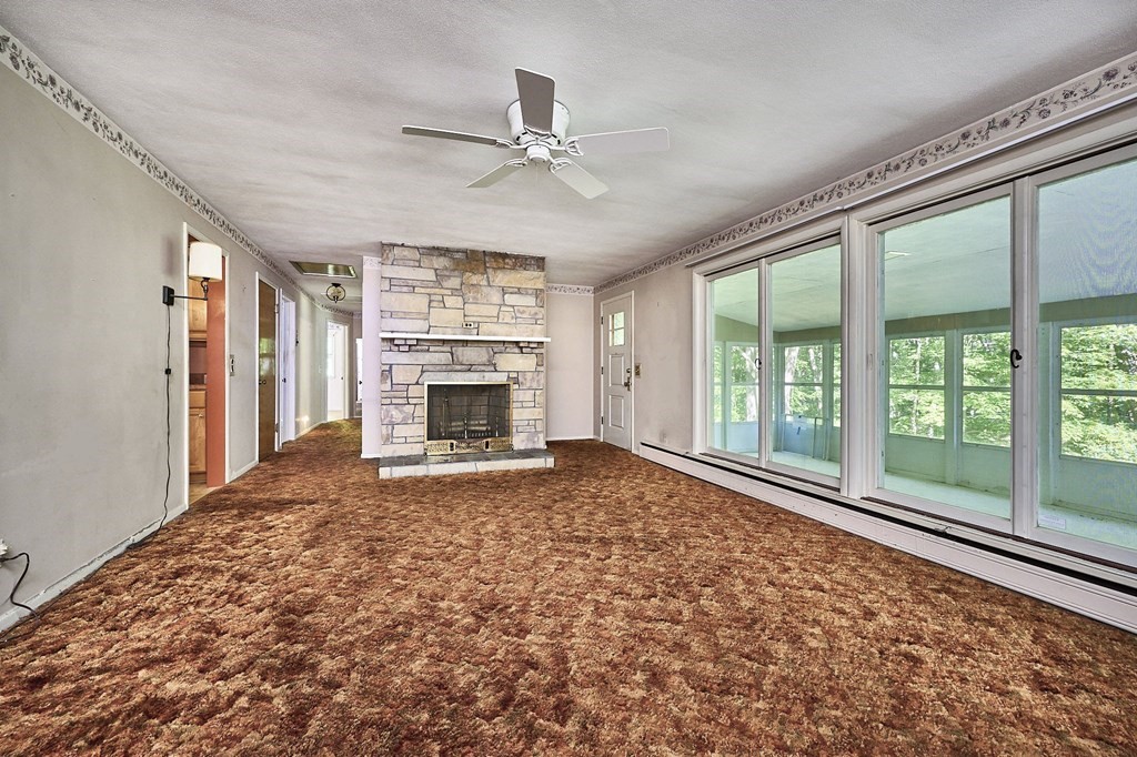 20 Southampton Road Holyoke, MA 01040 - Photo 4 of 28 a view of an empty room with a fireplace and a window
