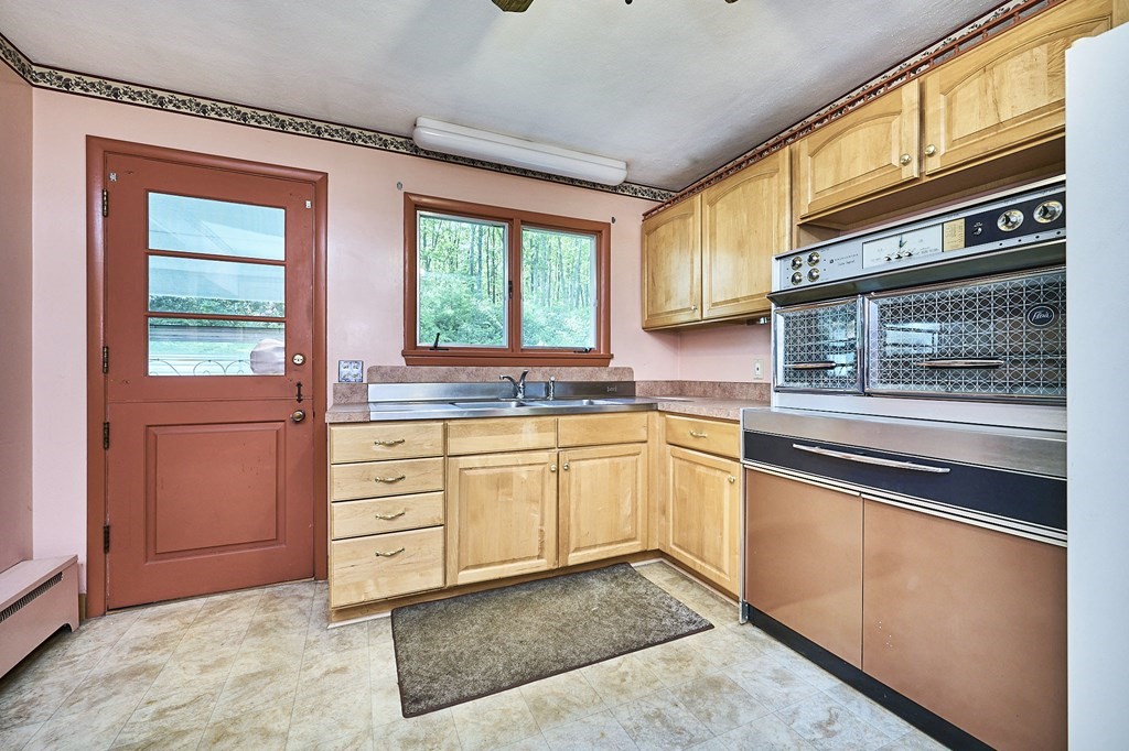 20 Southampton Road Holyoke, MA 01040 - Photo 7 of 28 a kitchen with granite countertop stainless steel appliances and sink