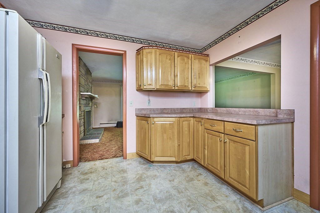 20 Southampton Road Holyoke, MA 01040 - Photo 8 of 28 a kitchen with stainless steel appliances granite countertop a sink and a refrigerator