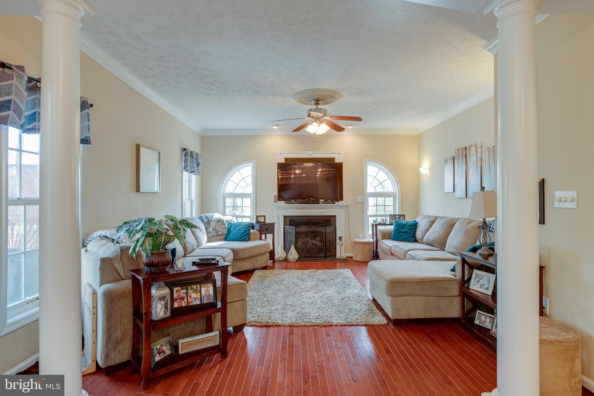 101 Saylers Creek Road Locust Grove, VA 22508 - Photo 17 of 81 a living room with fireplace furniture and a flat screen tv