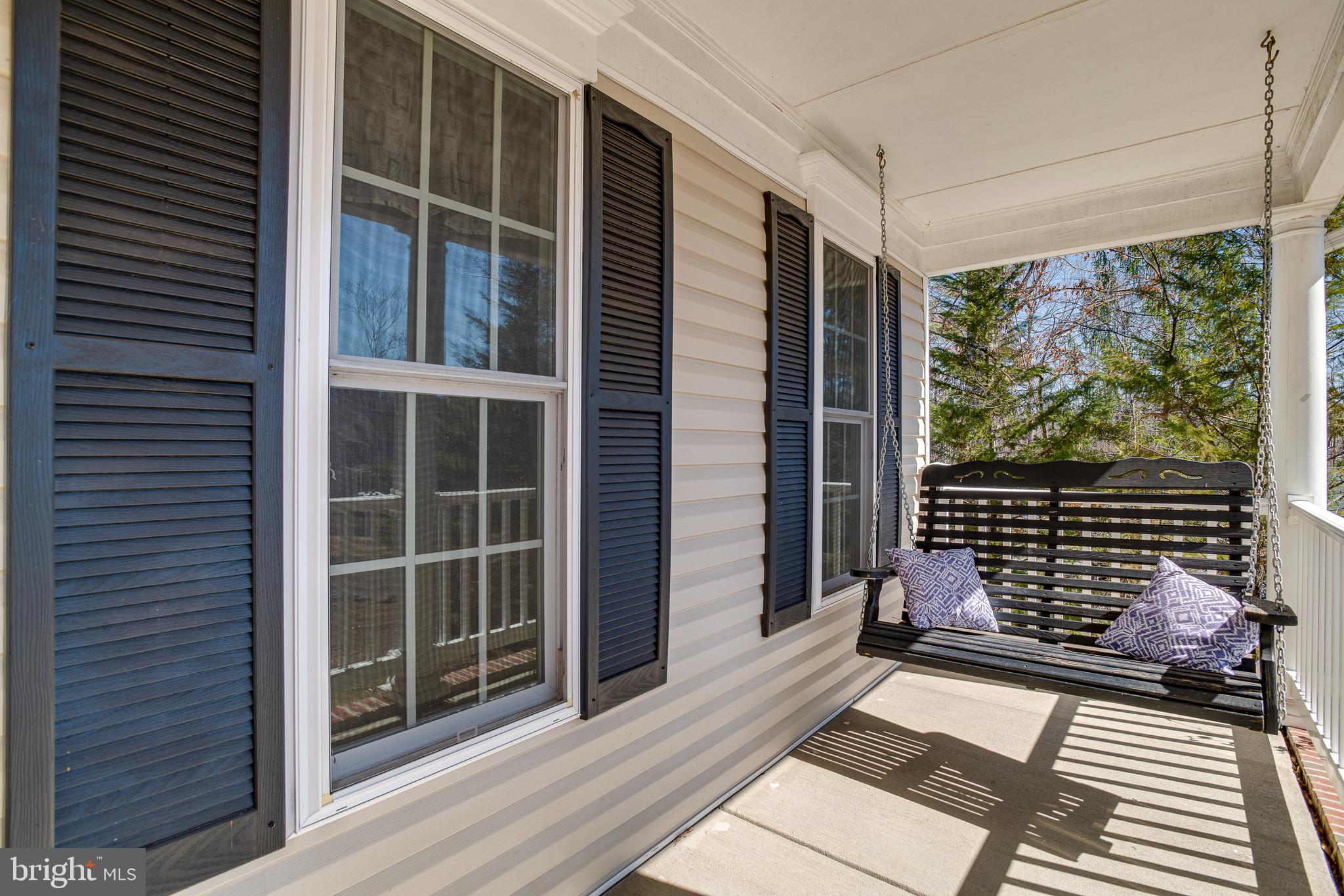 101 Saylers Creek Road Locust Grove, VA 22508 - Photo 46 of 81 a view of a balcony with a floor to ceiling window and wooden floor
