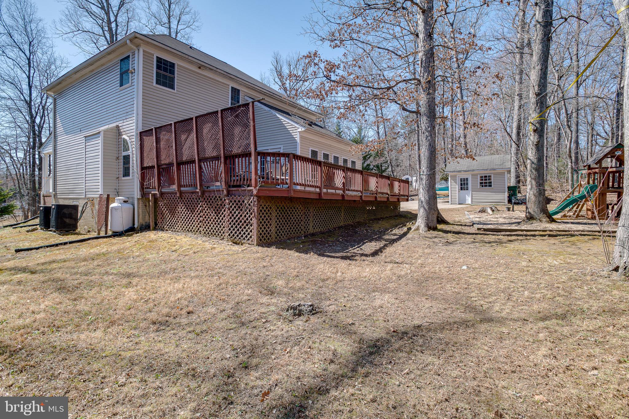 101 Saylers Creek Road Locust Grove, VA 22508 - Photo 55 of 81 a front view of a house with a yard covered with snow in front of house